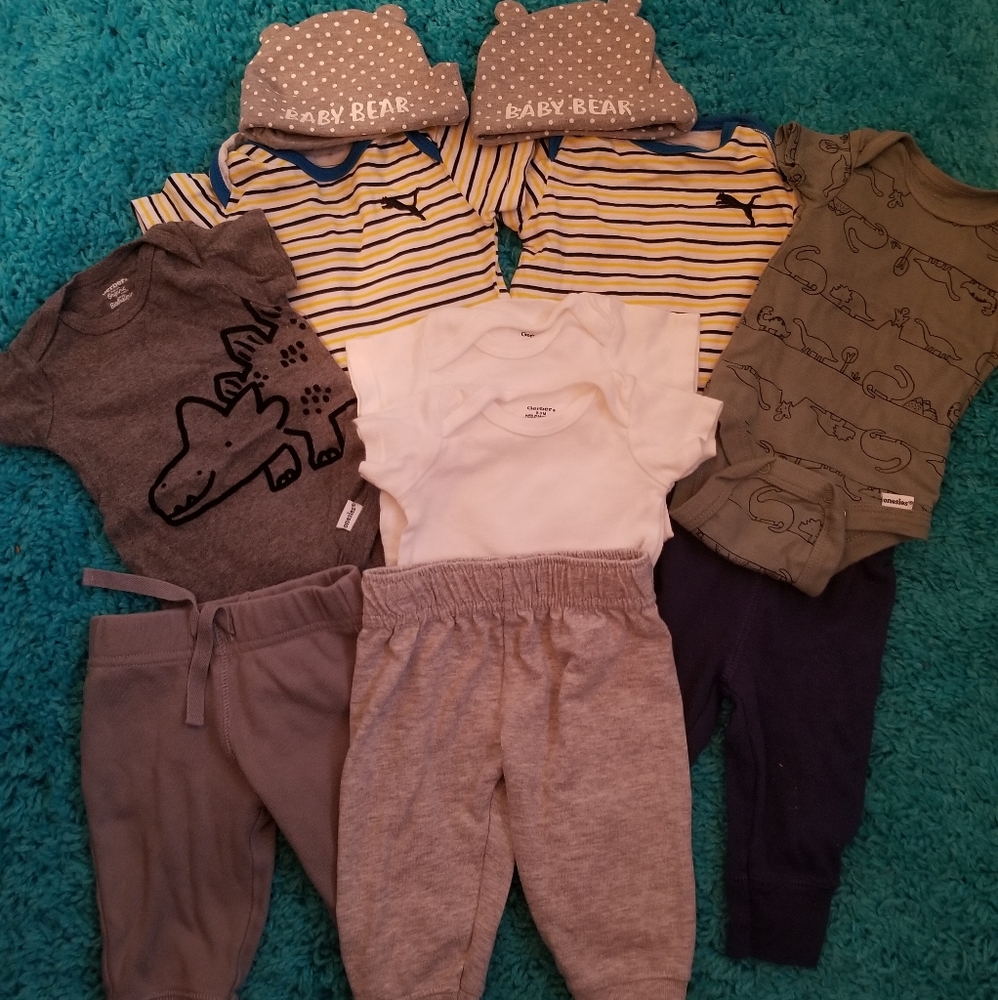 2 Puma Onesie 4 Gerber Onesie and 3 pair of pants